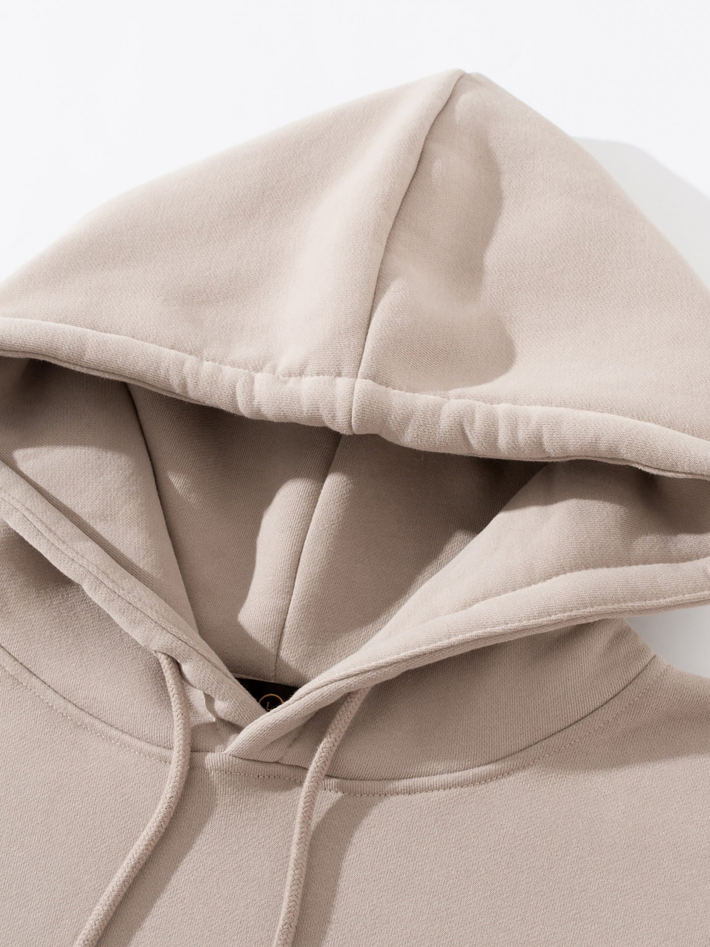 Close-up of heavyweight fabric and stitching on VÉRON premium hoodie 5.