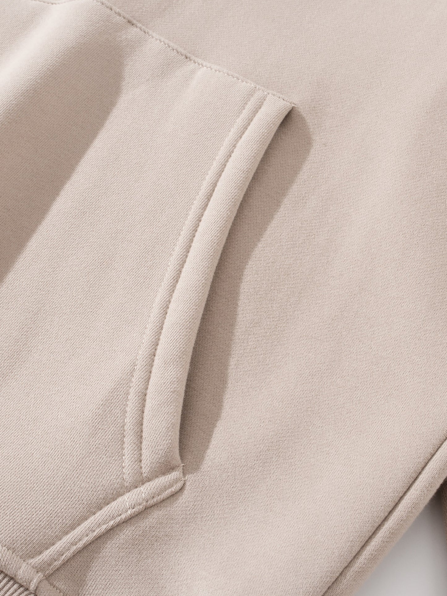 Close-up of beige fabric with a pocket detail 1.