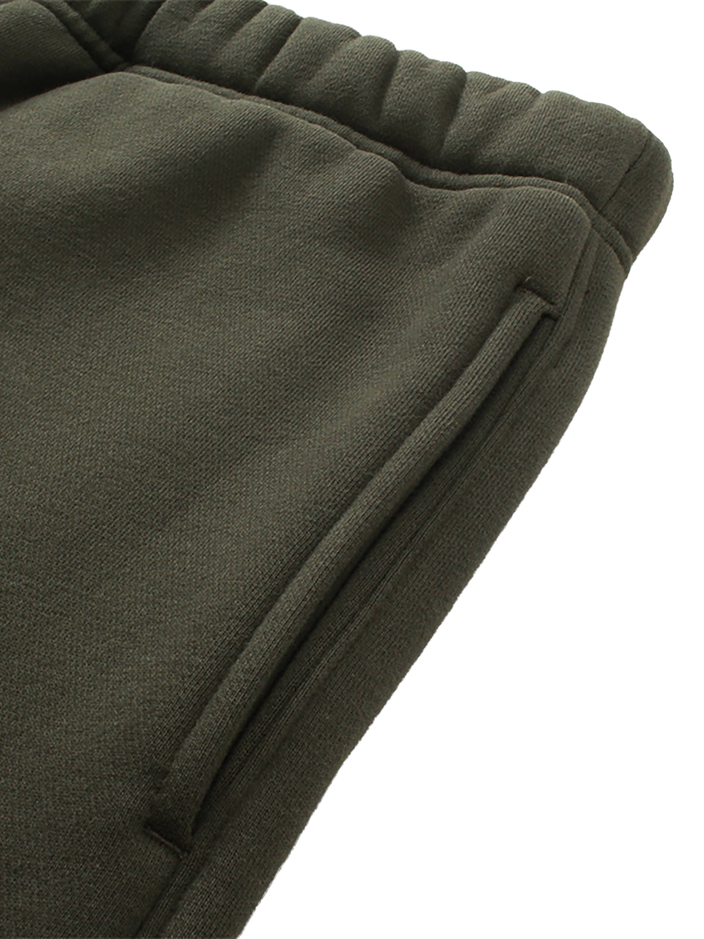 Close-up of green fabric with a white background.