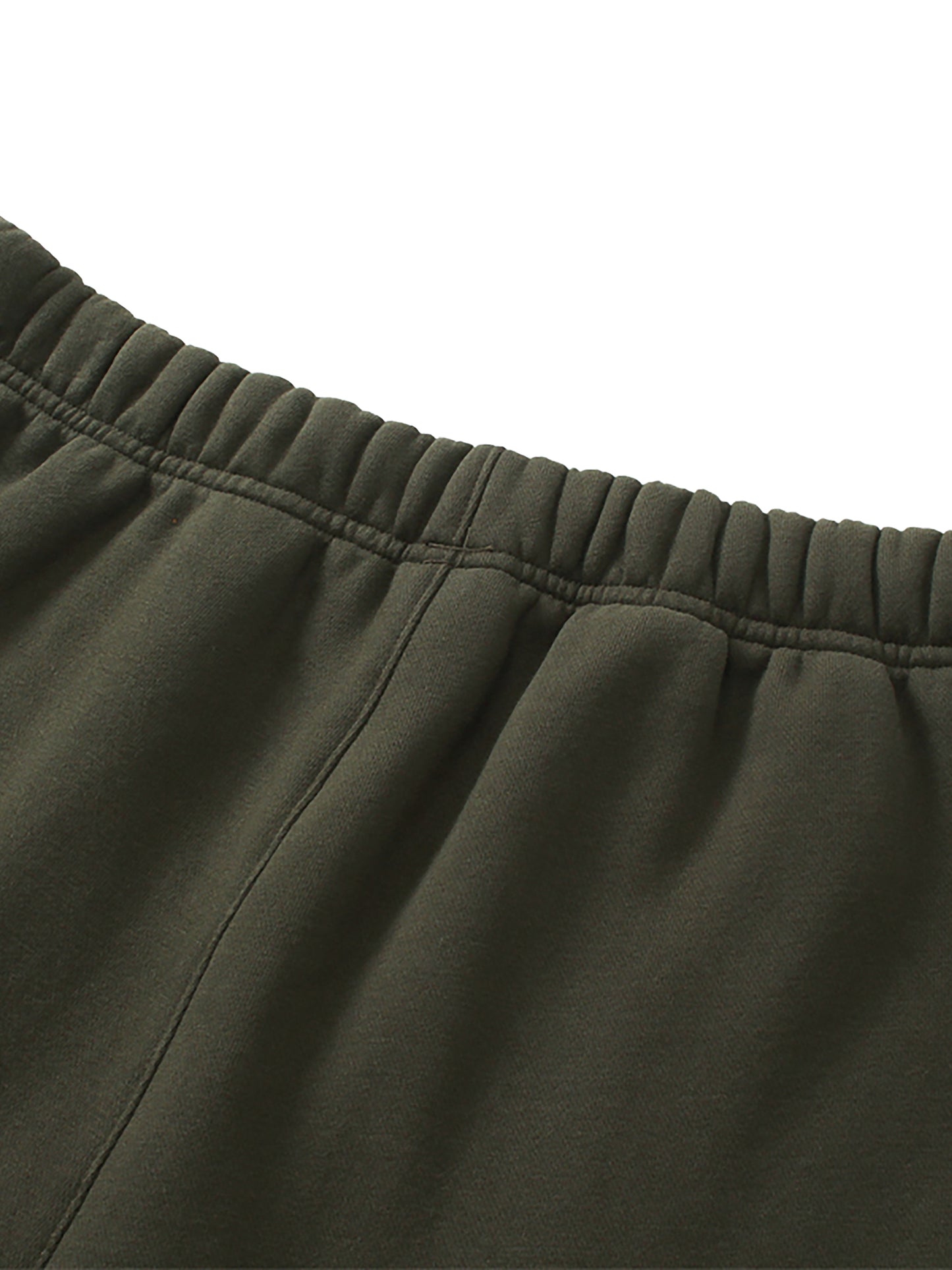 Close-up of green pants with an elastic waistband on a white background