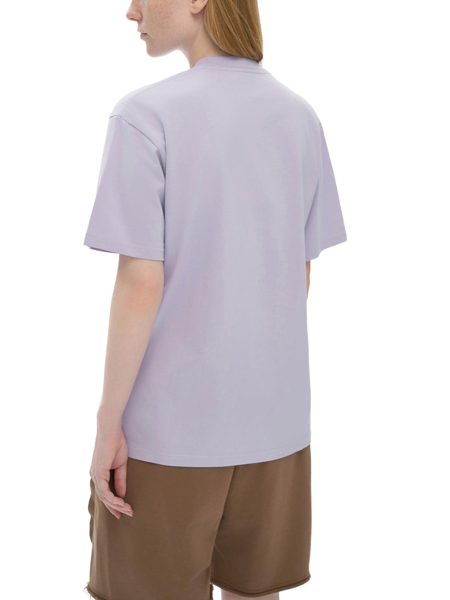 Back view of VÉRON premium streetwear T-shirt on female model 1