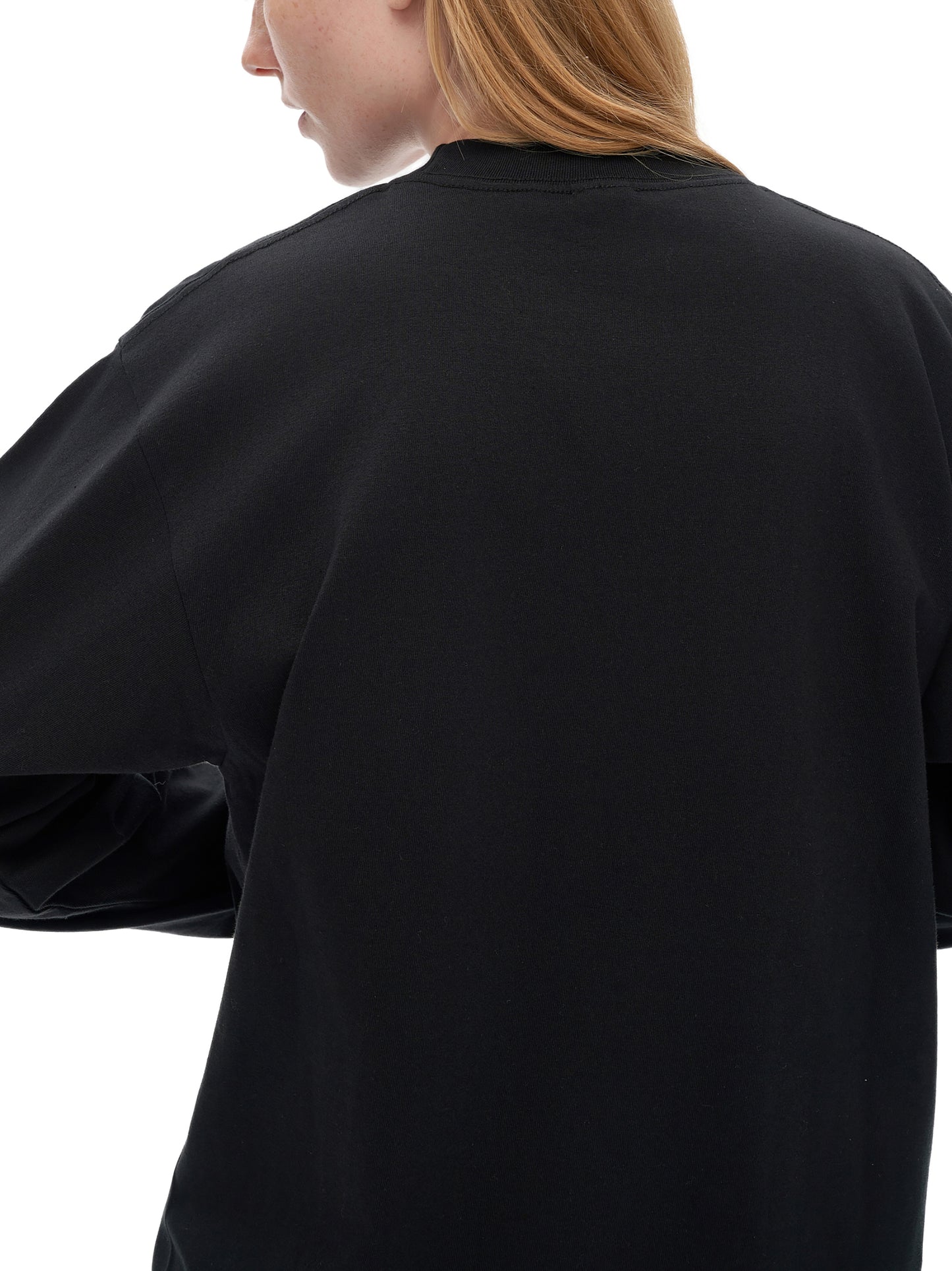 VERON Black sweatshirt worn by a person on a white background