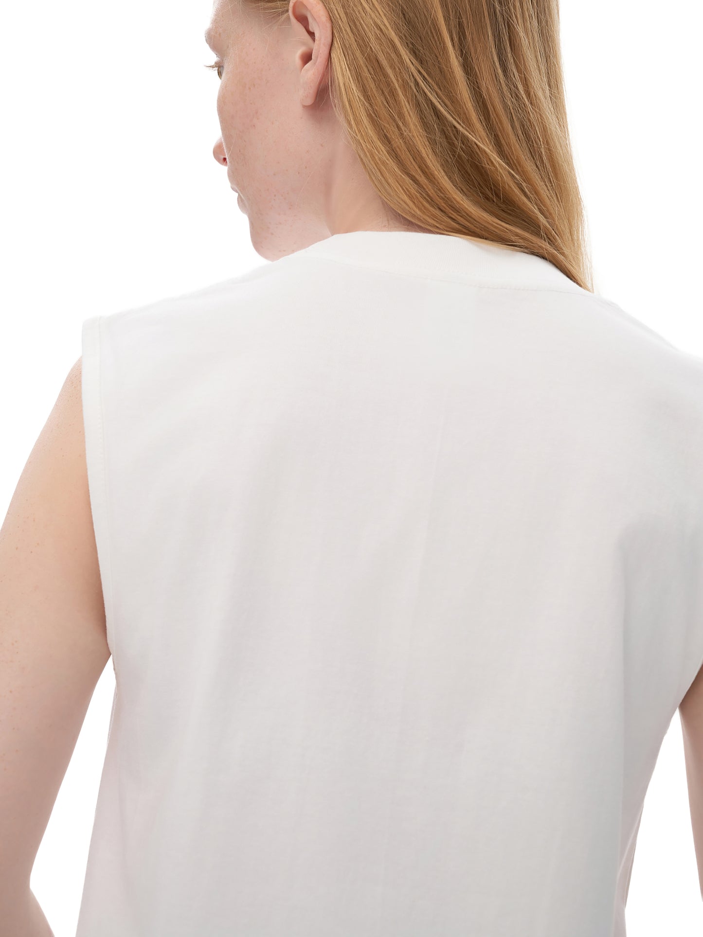 White sleeveless top worn by a person on a white background