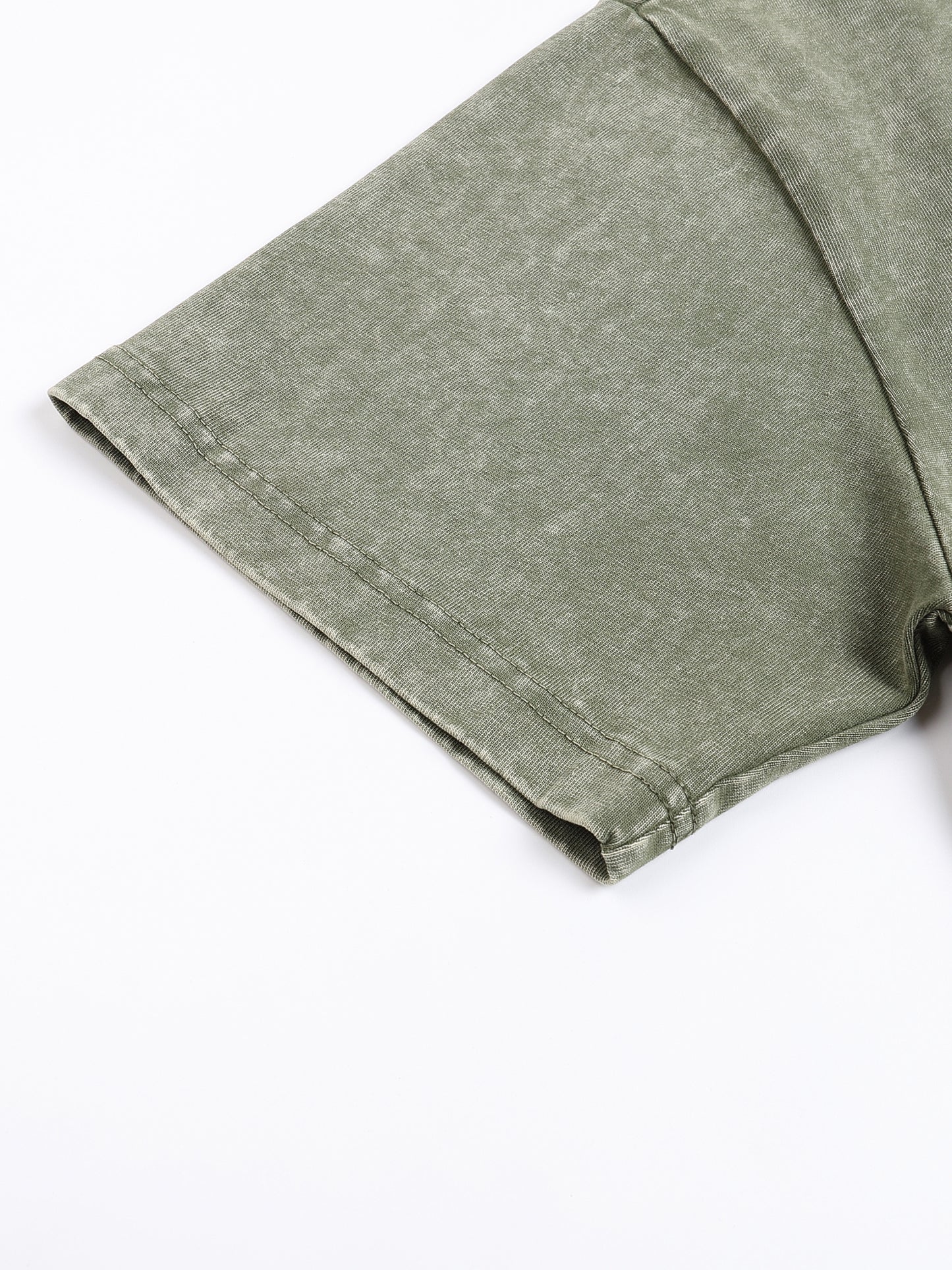 Green fabric folded on a white background