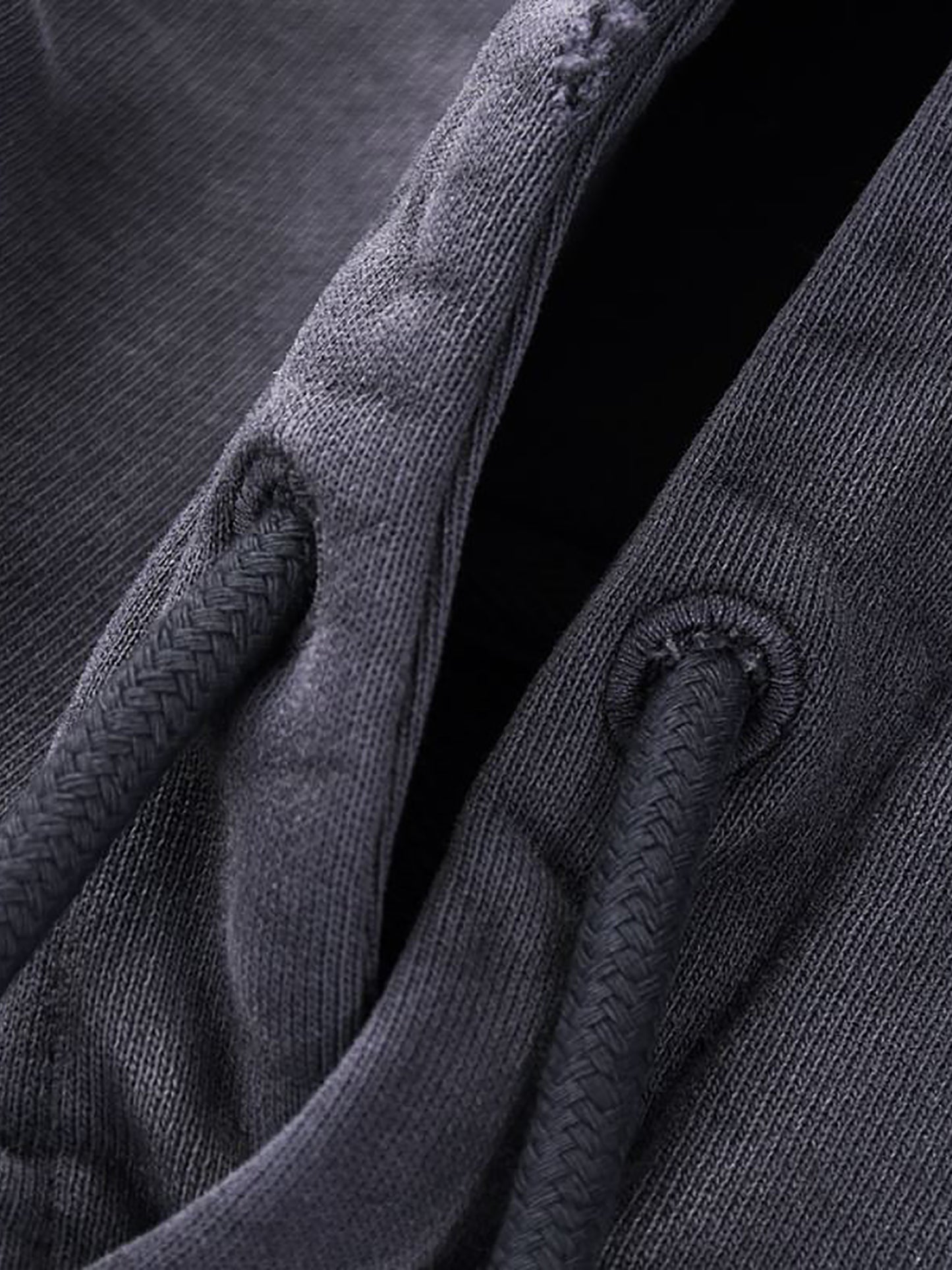 Close-up of dark gray fabric with textured pattern