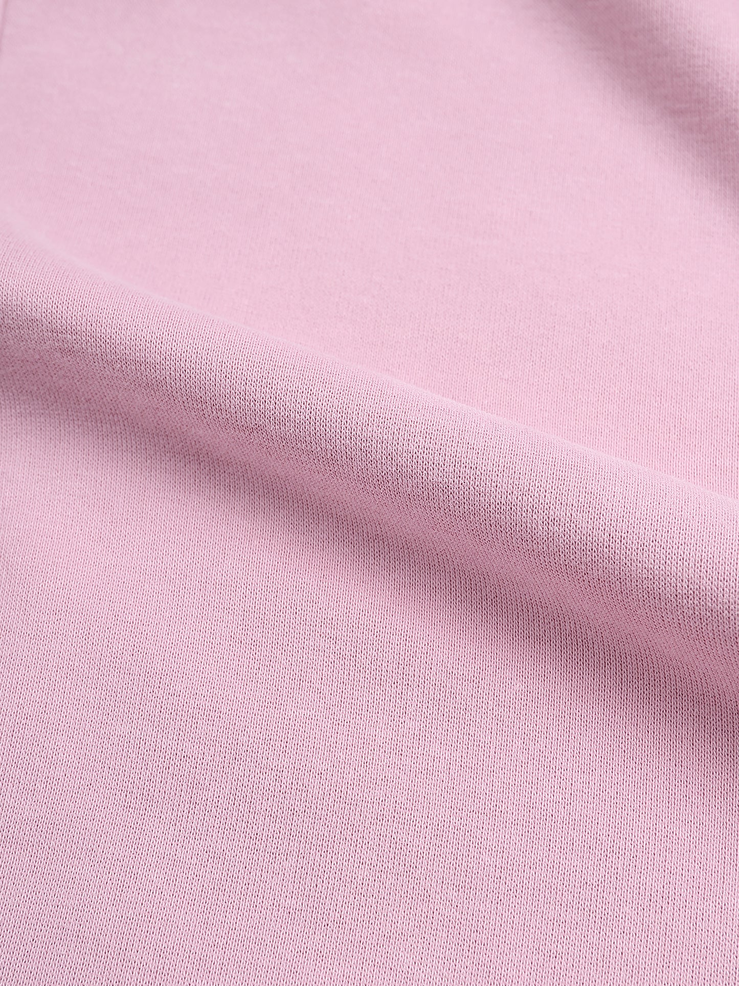 Close-up of pink fabric with a subtle texture