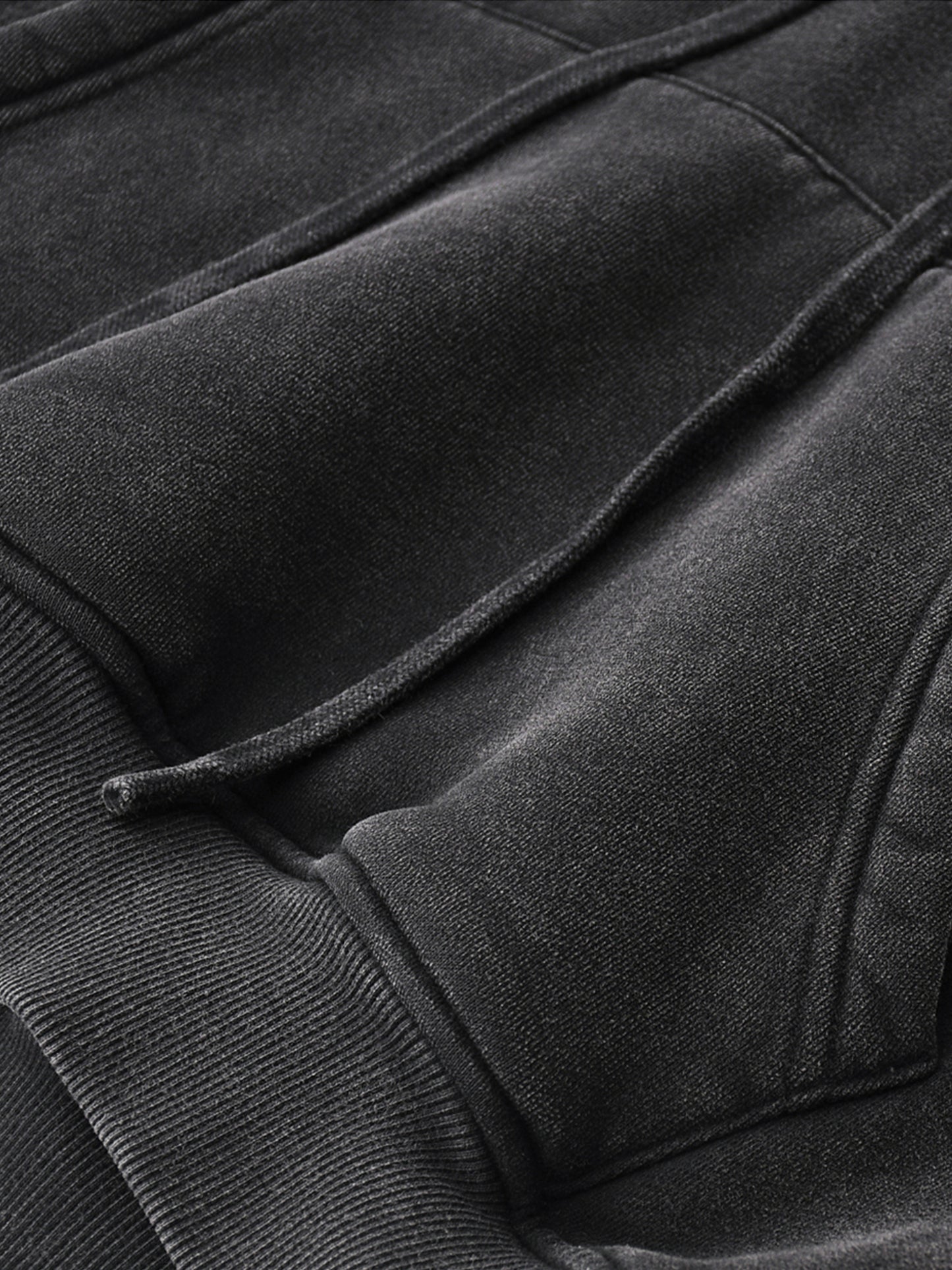 Close-up of a textured black fabric surface