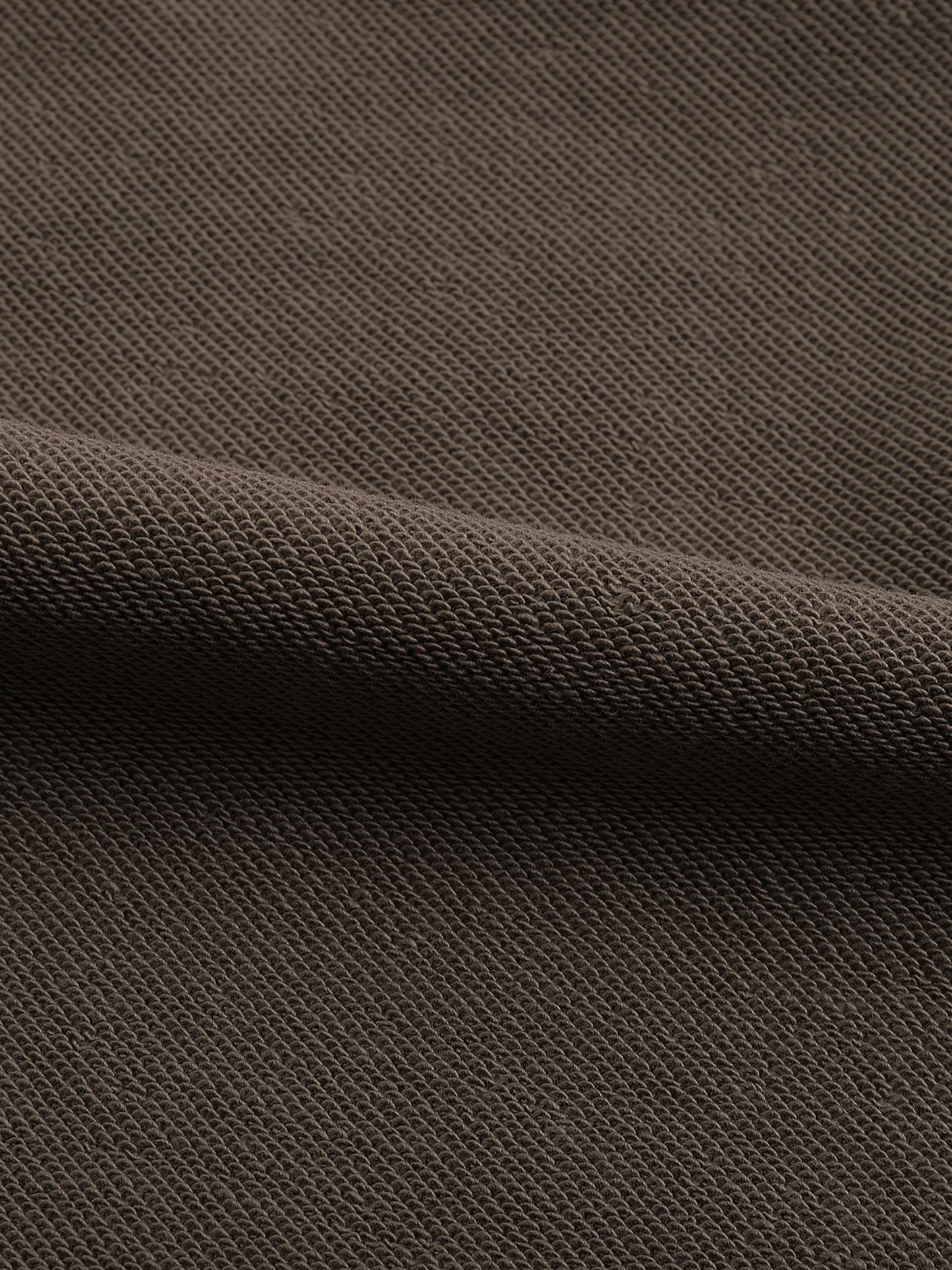 Close-up of brown textured fabric.