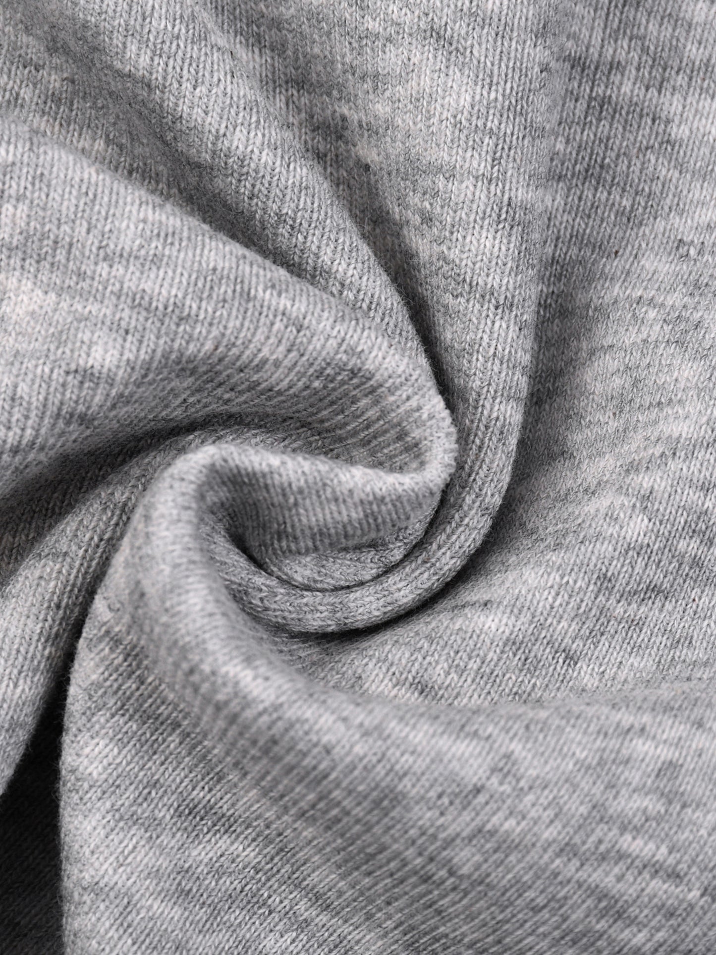Close-up of gray fabric with a textured pattern.