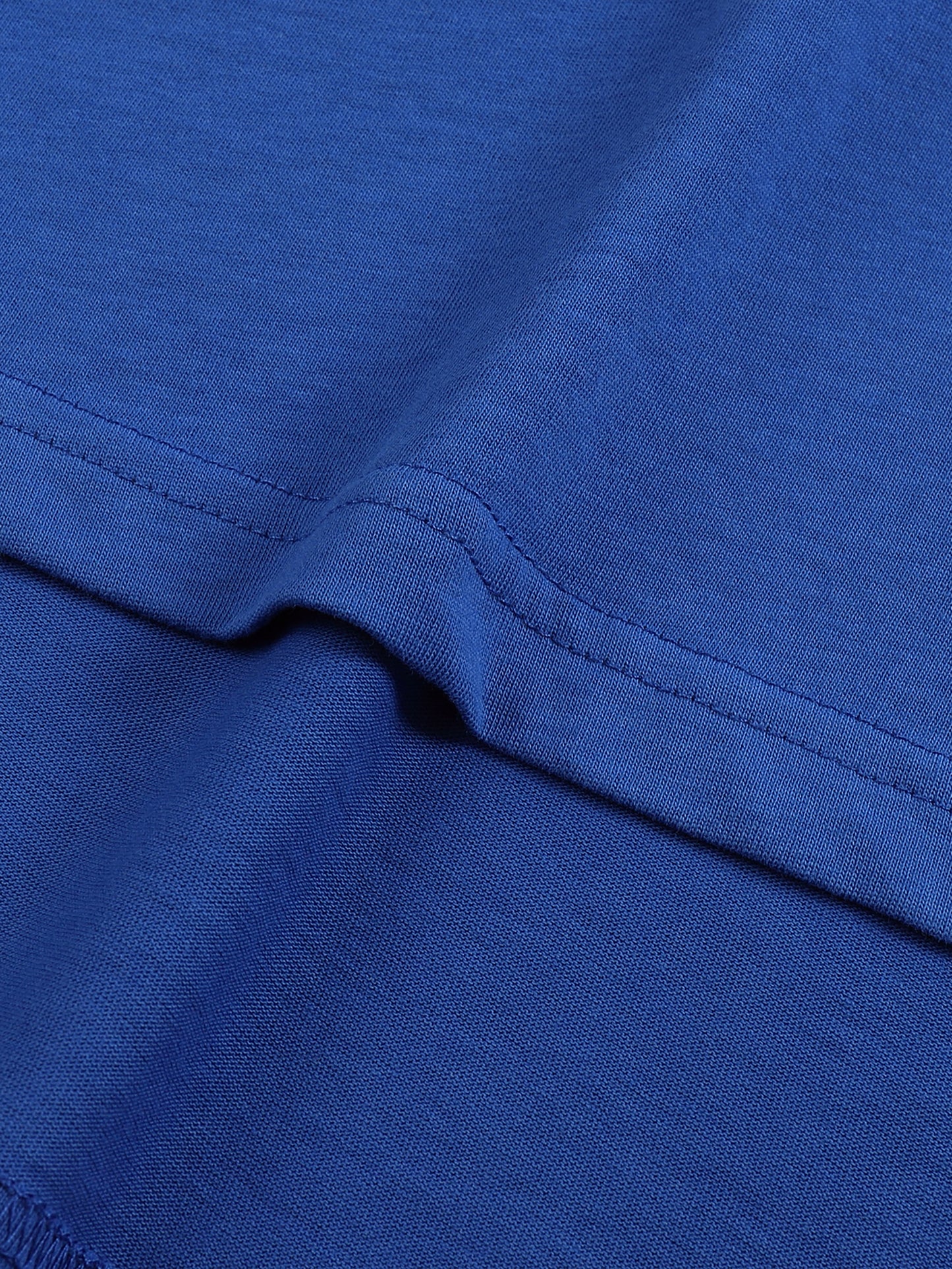 Close-up of blue fabric with a visible seam