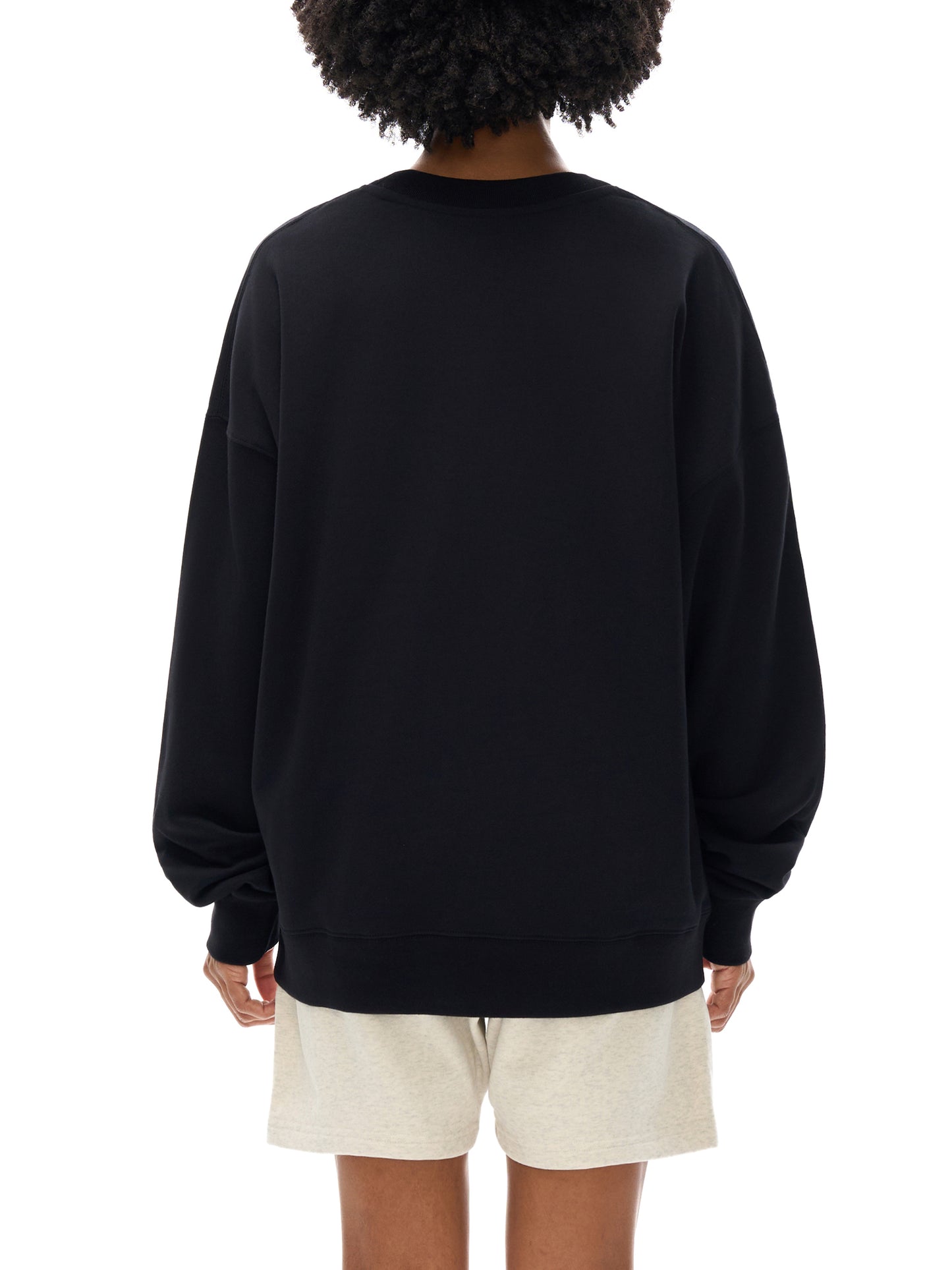 Model wearing VÉRON Notre-Dame unisex sweater with modern fit.