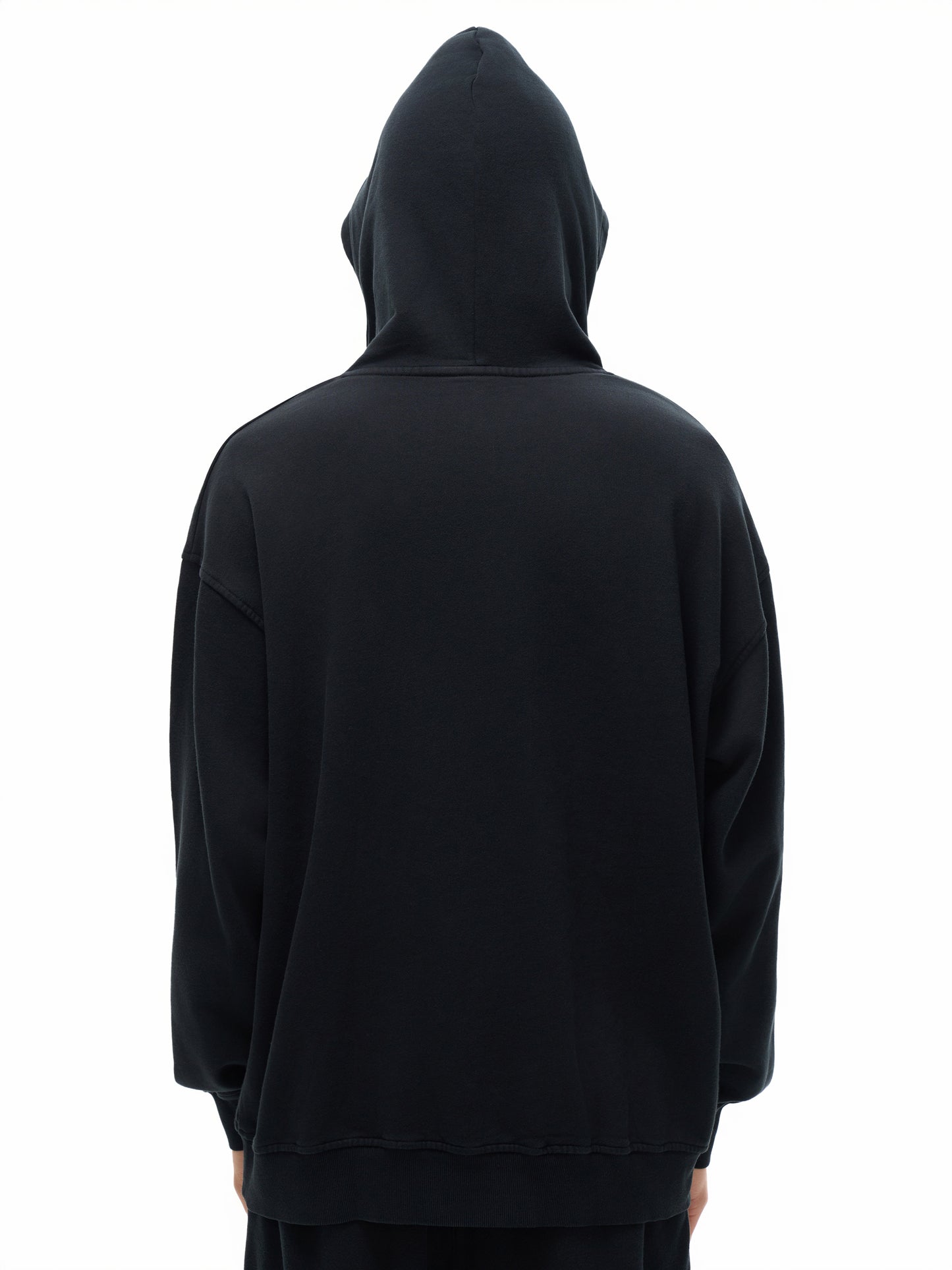 VERON Black hoodie worn by a person on a white background