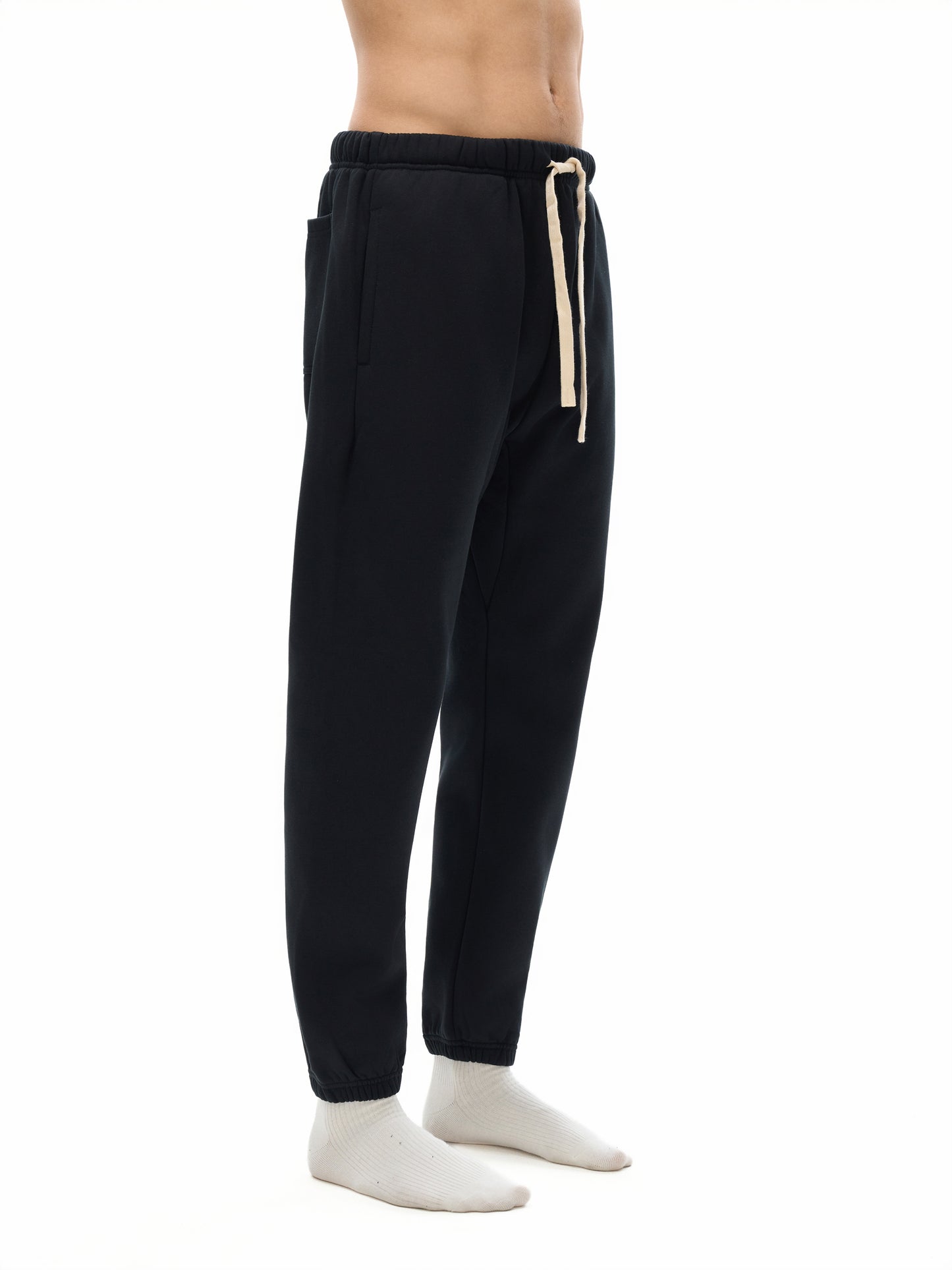 Model styling VÉRON designer sweatpants with modern streetwear fit 2