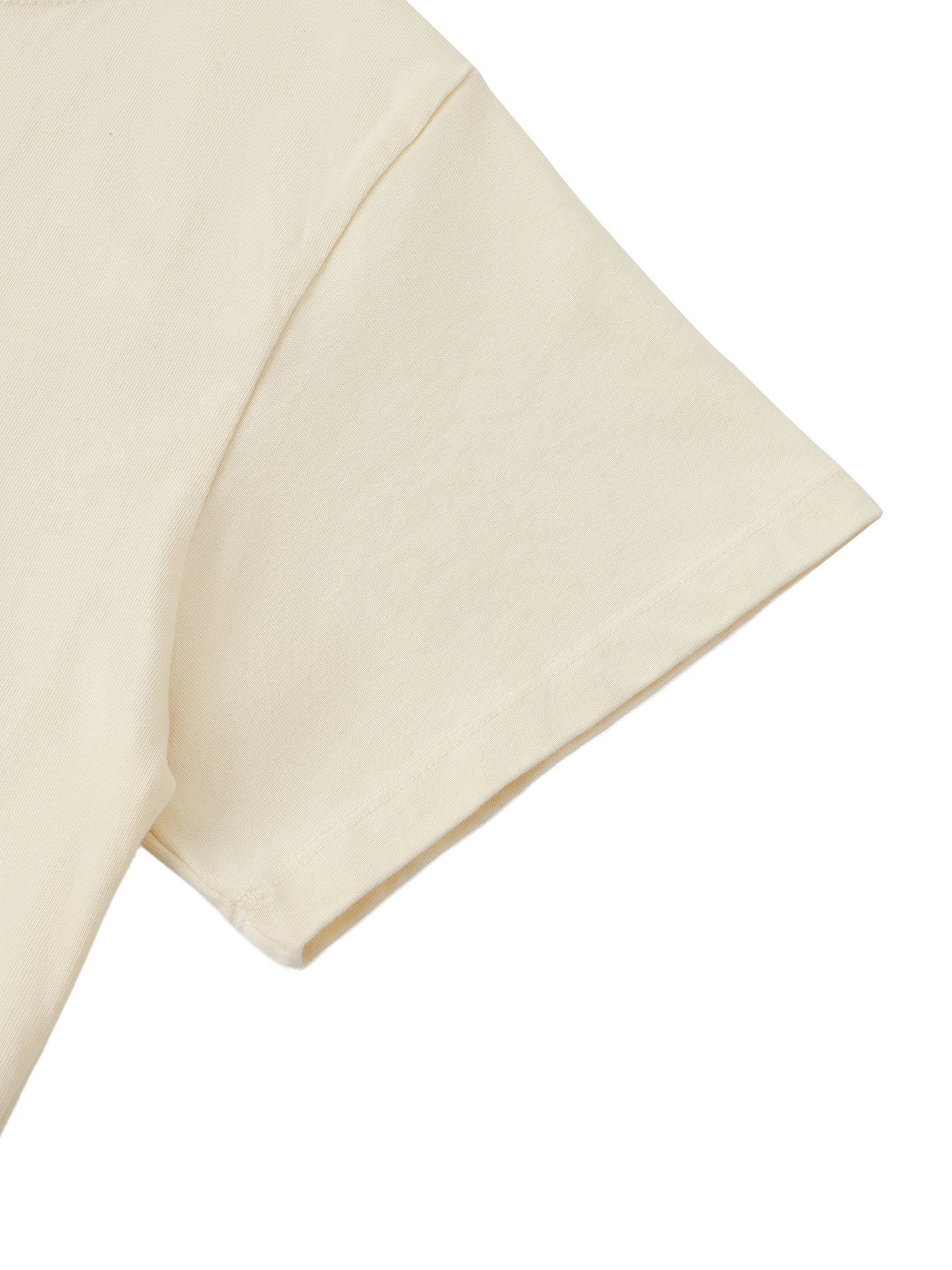 Close-up of beige fabric with a subtle pattern on a white background