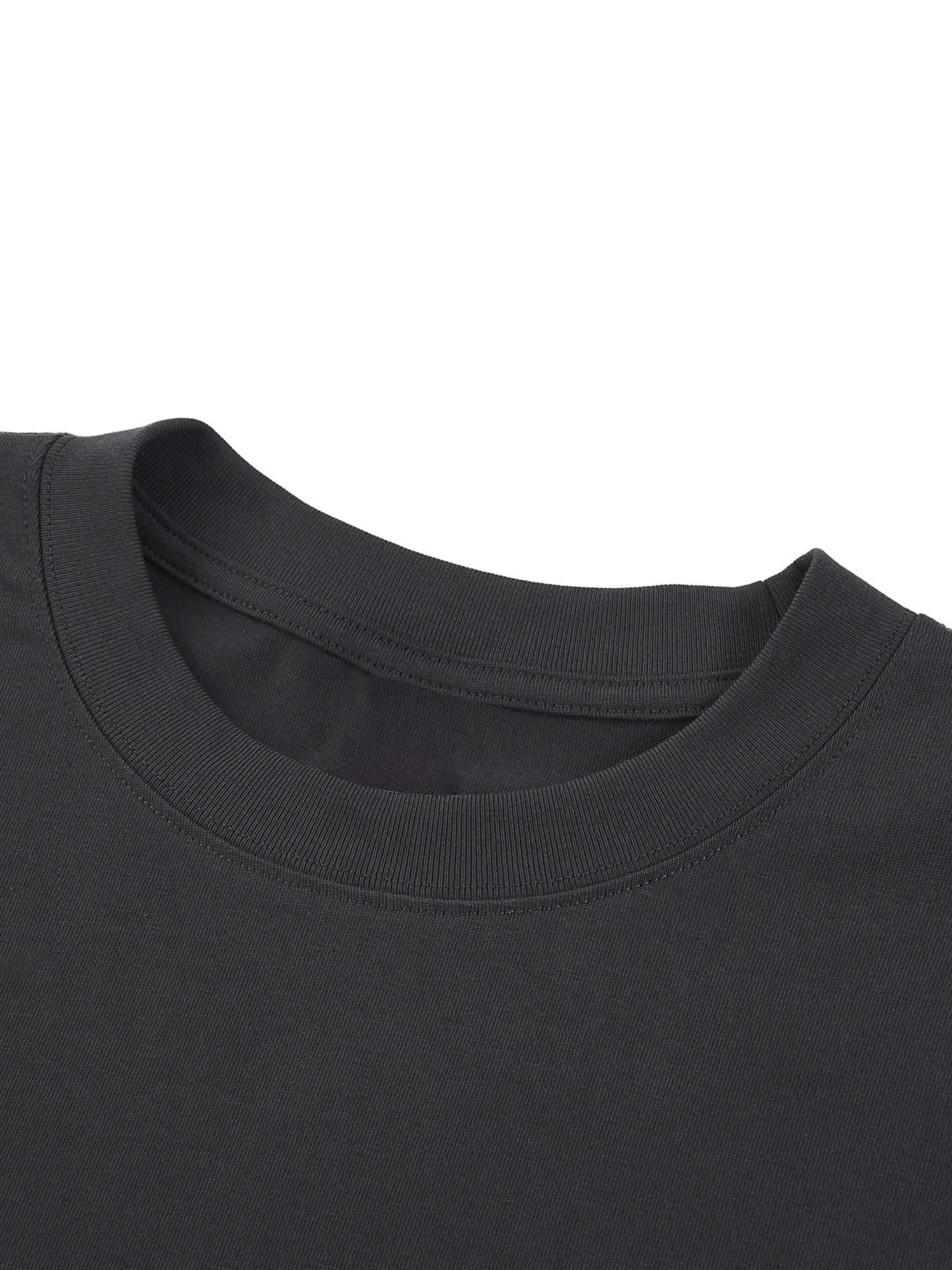 Close-up of a black t-shirt collar on a white background