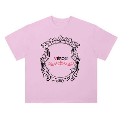 Pink t-shirt with decorative frame and 'Véron' text on a white background