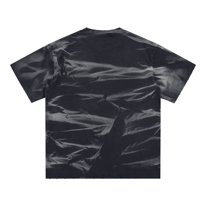 Black t-shirt with a subtle pattern on a white background