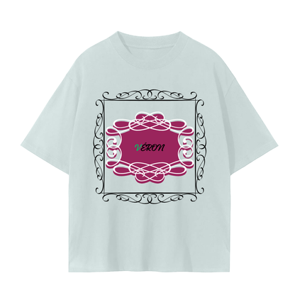 Light blue t-shirt with a pink floral design and 'Véron' text on a white background
