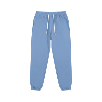 Light blue sweatpants with a drawstring on a white background