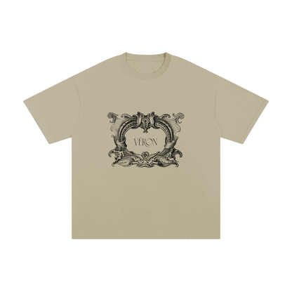 Beige t-shirt with decorative emblem and 'VERON' text on a white background
