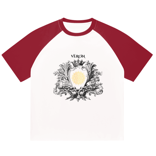 White t-shirt with red sleeves featuring a decorative emblem and 'VERON' text on a white background