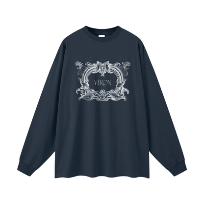 Navy blue long-sleeve shirt with decorative white logo on a white background