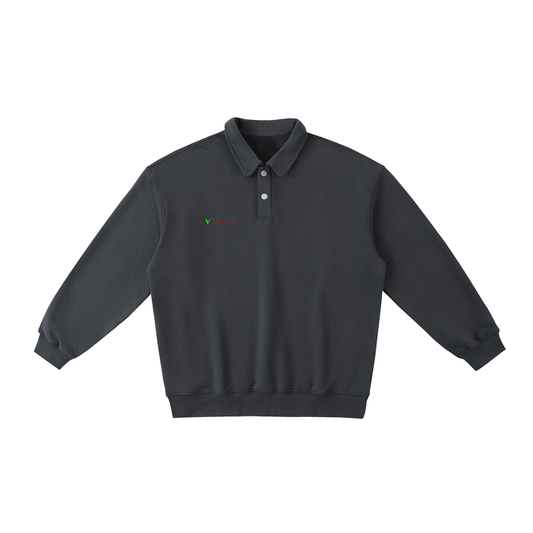 VÉRON sweatshirt folded with visible polo collar and logo tag. 

