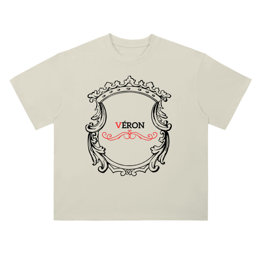 Beige t-shirt with decorative frame and 'Véron' text on a white background