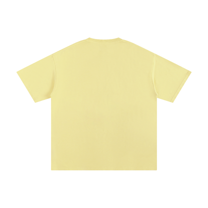 Plain light yellow t-shirt on a white background