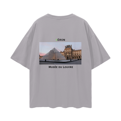 Gray t-shirt with a graphic of the Louvre Museum on the back