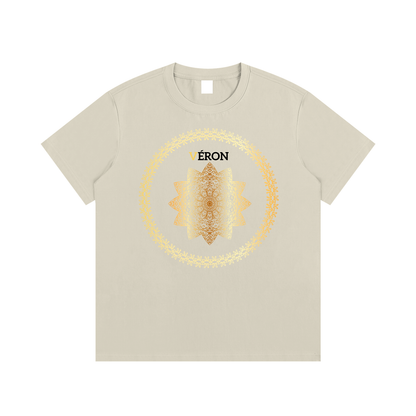 Beige t-shirt with a central design and 'VÉRON' branding on a white background