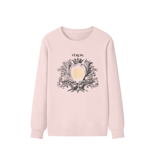 Pink sweatshirt with decorative emblem and 'Véron' text on a white background