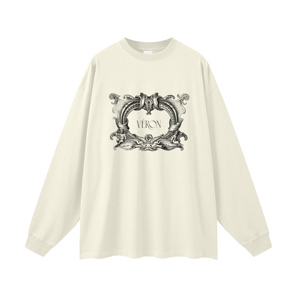 White long-sleeve shirt with decorative graphic and 'VERON' text on a white background