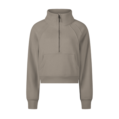 Beige half-zip sweatshirt on a white background