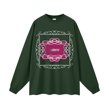 Green long-sleeve shirt with pink decorative design and 'VERON' text on a white background