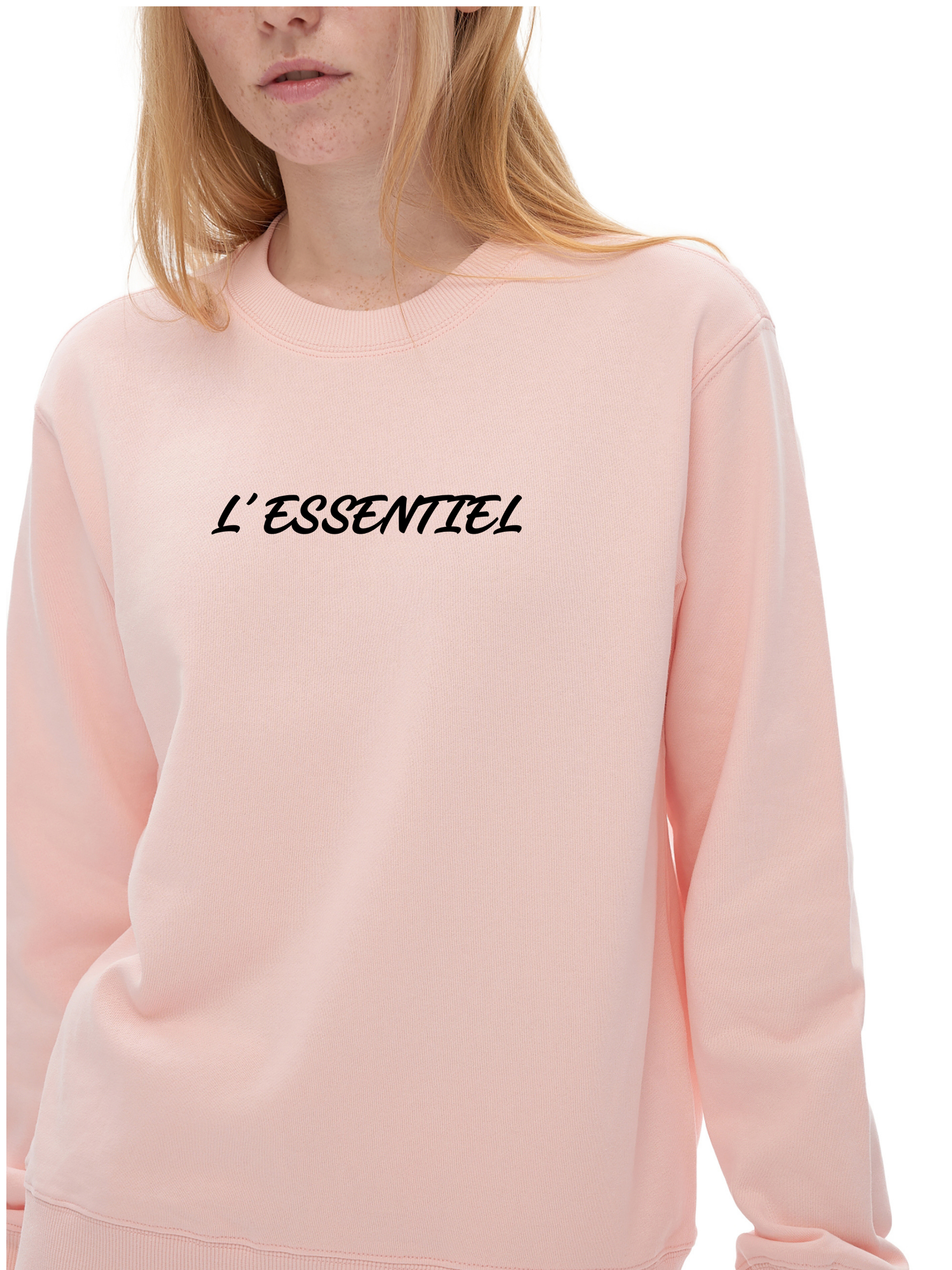 Pink sweatshirt with 'L'ESSENTIEL' text on a white background