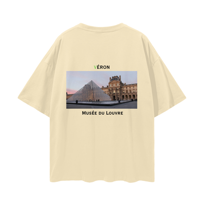 Beige t-shirt with Louvre Museum graphic and 'VERON' branding on a white background