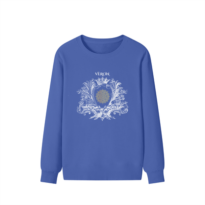 Blue sweatshirt with decorative design and 'Véron' text on a white background