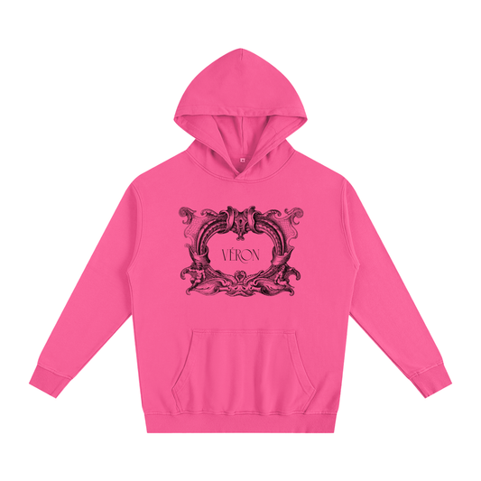 Pink hoodie with decorative design and 'VERON' text on a white background