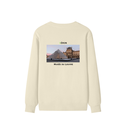 Beige sweatshirt with a graphic of the Louvre Museum on the back