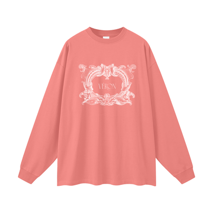 Coral long-sleeve shirt with white decorative design and text on a white background