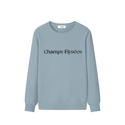 Light blue sweatshirt with 'Champs Élysées' text on a white background