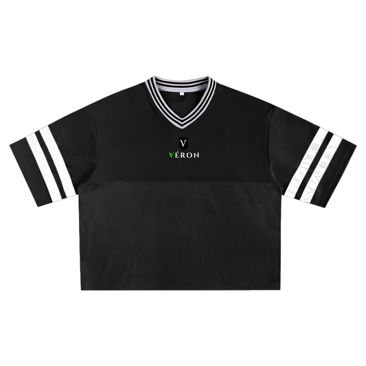 Black sports jersey with white accents and 'Véron' logo on a white background