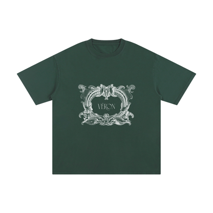 Green t-shirt with decorative emblem and 'VERON' text on a white background