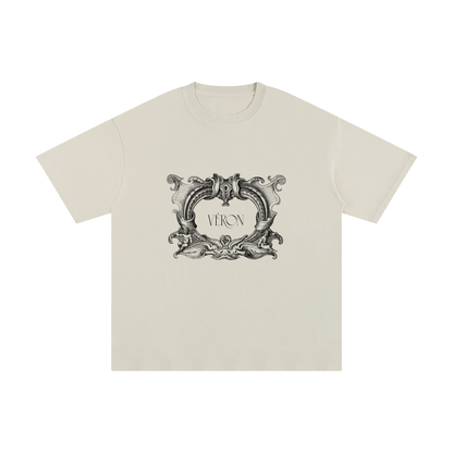 Beige t-shirt with decorative black graphic and 'VERON' text on a white background