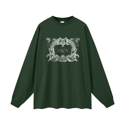 Green long-sleeve shirt with decorative emblem and 'VERON' text on a white background