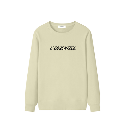 Beige long-sleeve shirt with 'L'ESSENTIEL' text on a white background