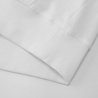 Close-up of a light gray quilted fabric on a matching background