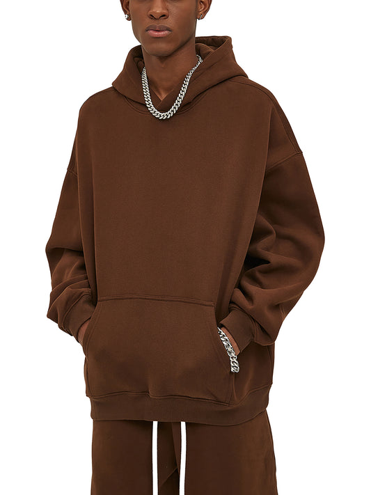 Person wearing a brown hoodie with a brand logo on a white background