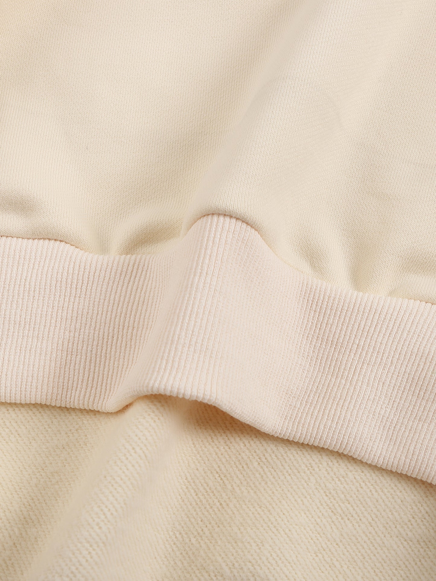 Close-up of a beige fabric with a ribbed texture